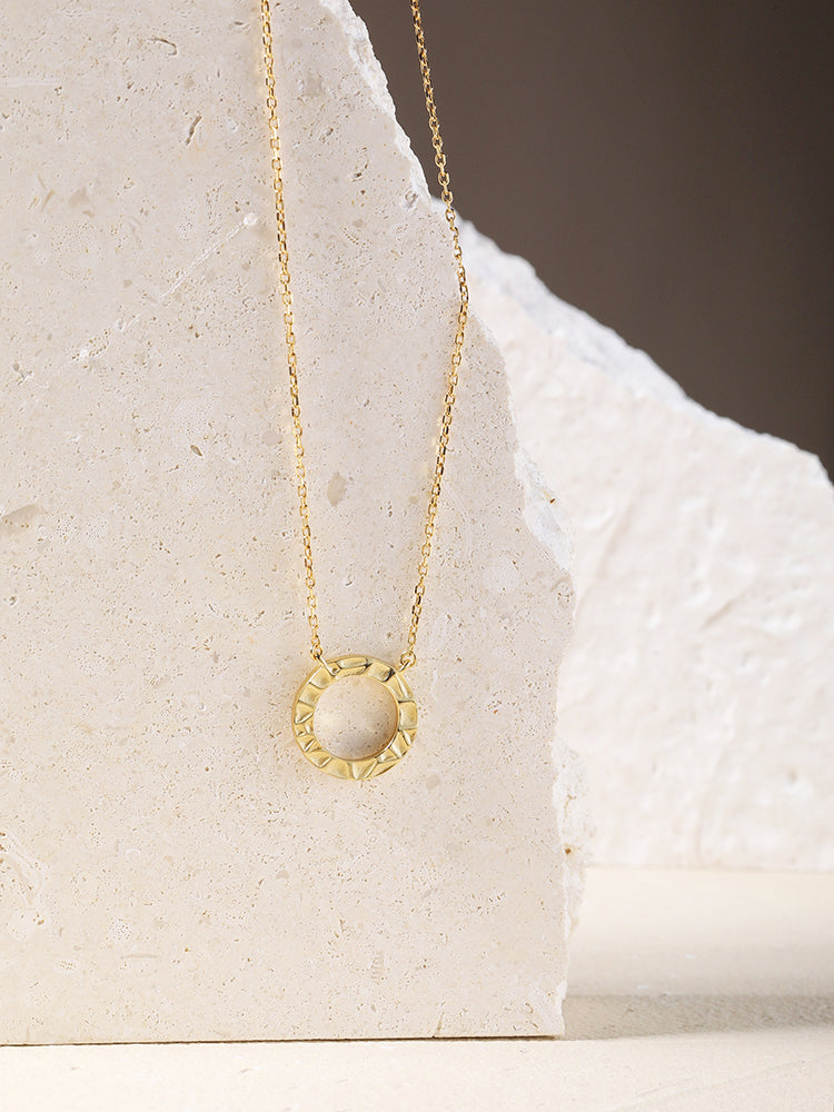 Gold circle necklace in sterling silver.